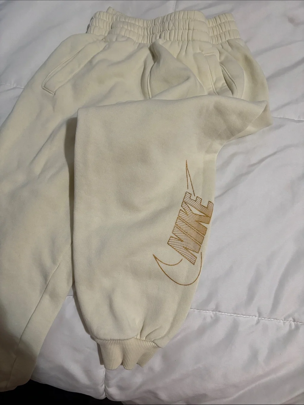 Nike Cream Sweatpants with Gold Logo Accent